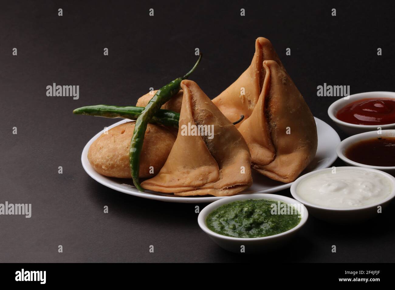 Kachori and samosa, Indian vegetarian snacks served with green and