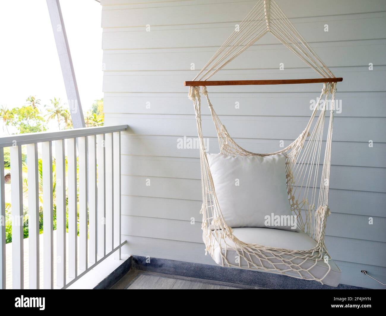 Empty white knitting rope swing hanging from ceiling on white wood  background in room terrace in the resort. Vintage white handcraft hammock  decoratio Stock Photo - Alamy