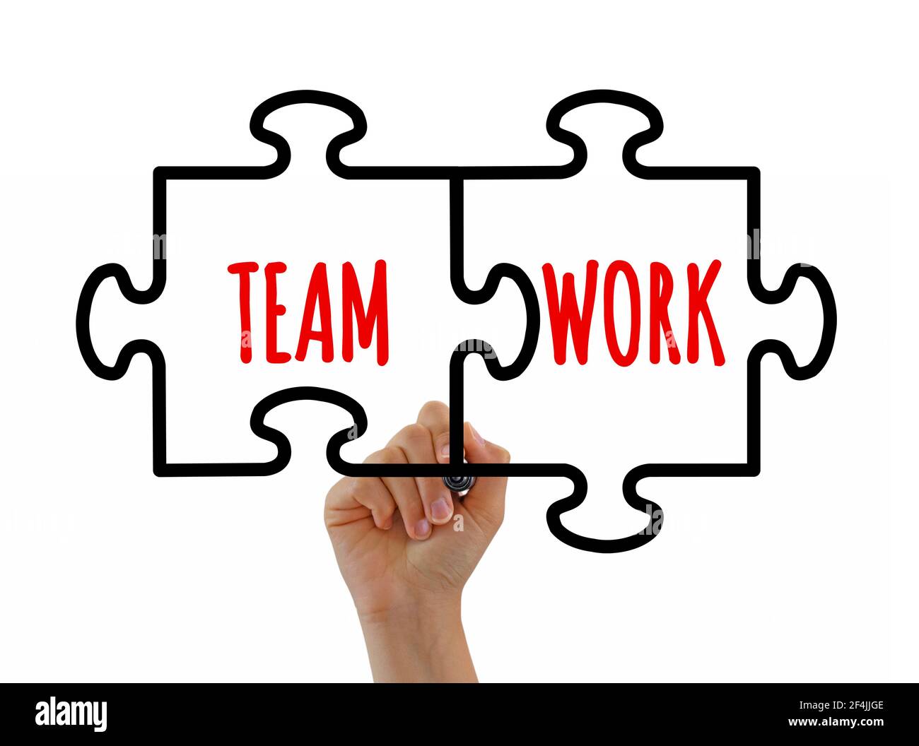 Hand sketching teamwork jigsaw puzzle pieces concept with black marker on transparent glass board or white background. Teamwork success concept. Stock Photo