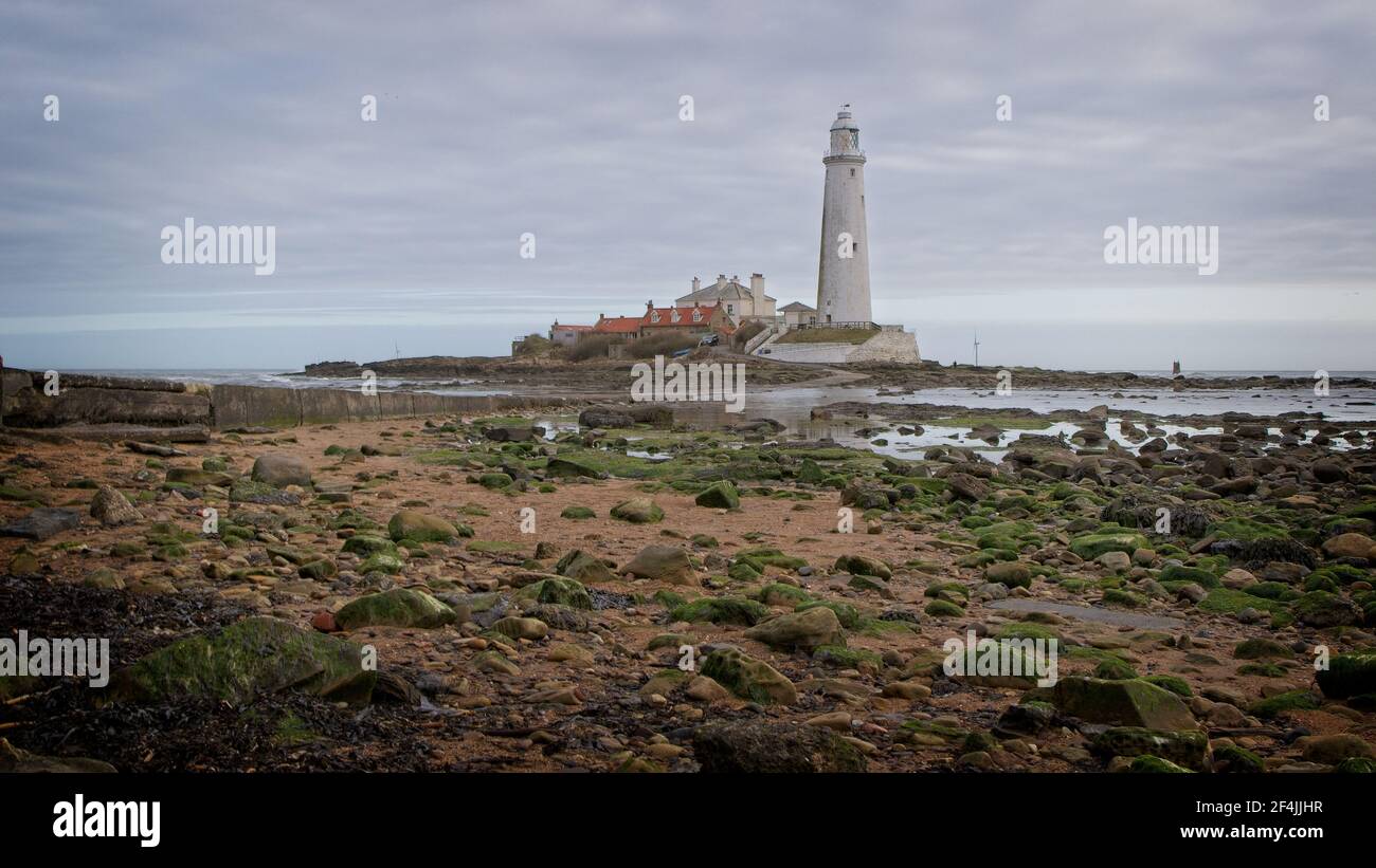 St Mary's Lighthouse stands on St Mary's Island just off the North Sea coast at Whitley Bay in North-East England. Stock Photo