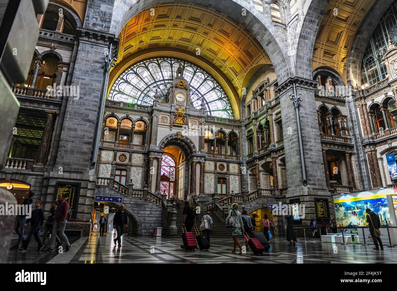 Antwerp, Belgium - July 12, 2019: Commuters passing through the Antwerp central train station in Belgium Stock Photo