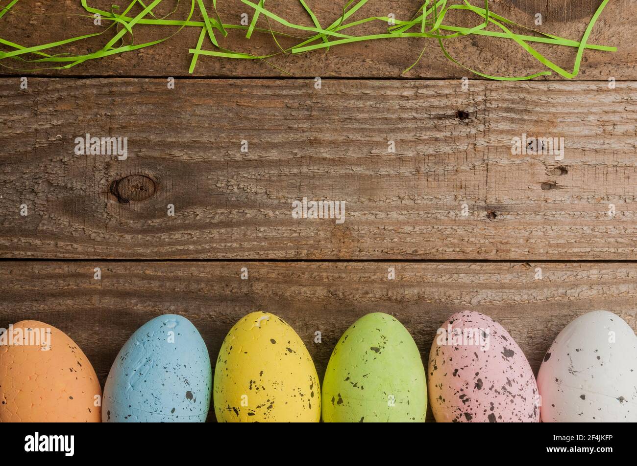 Simple easter background: colored easter eggs on a wooden table Stock Photo