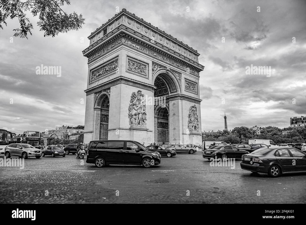 Paris, France - July 18, 2019: Black and white photo of the Triumphal Arch of Paris in France, with busy traffic around it. Stock Photo