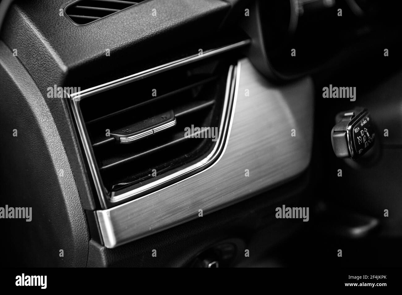 Car air conditioning system grid panel on console, air ventilation. Close up deflector. Car air conditioner . Stock Photo