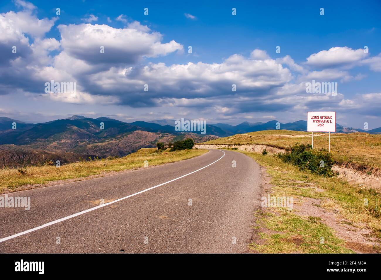 On the road to the Republic of Artsakh, or Nagorno Karabakh. The sign says 'Free Artsakh Welcomes You'. Stock Photo