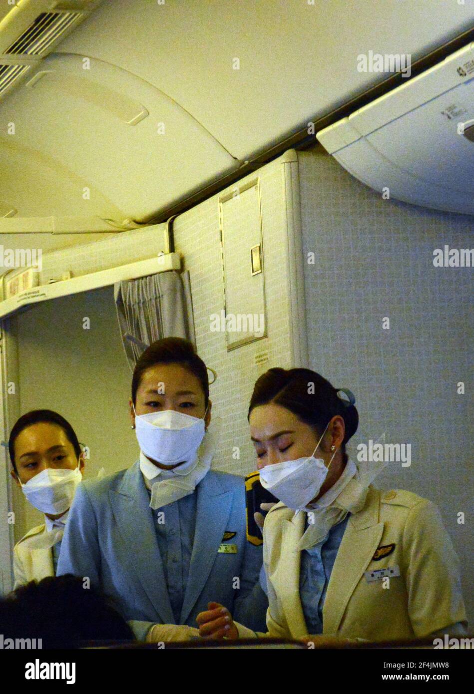 Korean Air flight attendants wearing surgical masks in the beginning of
