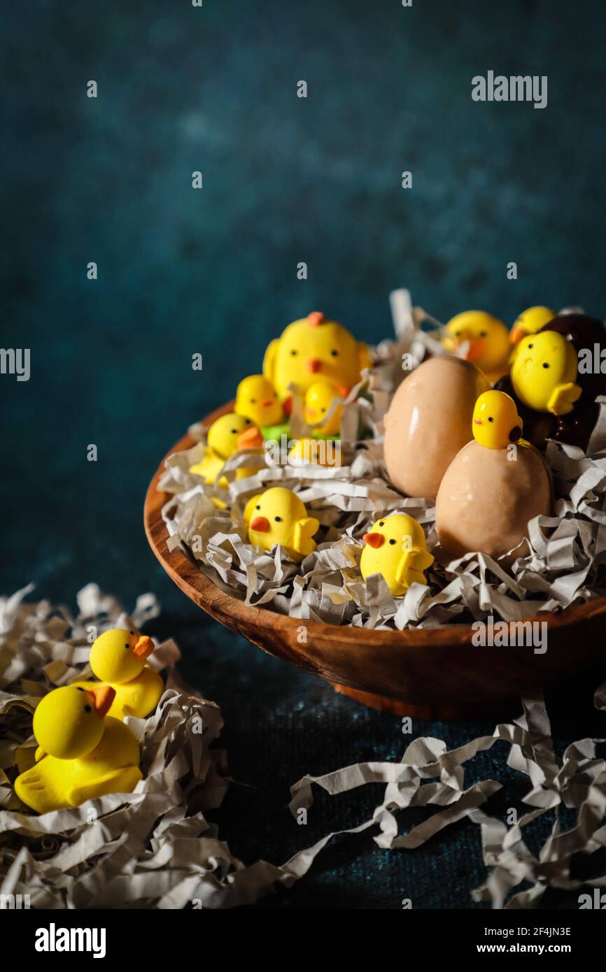 Easter Basket of Chocolate Eggs and Gum Paste Chicks and Duckling Stock Photo