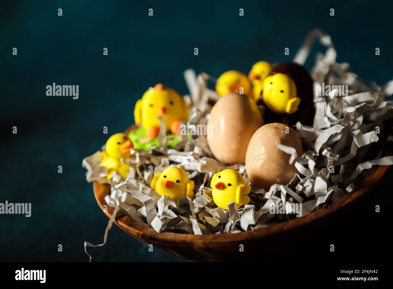 Easter Basket of Chocolate Eggs and Gum Paste Chicks and Duckling Stock Photo