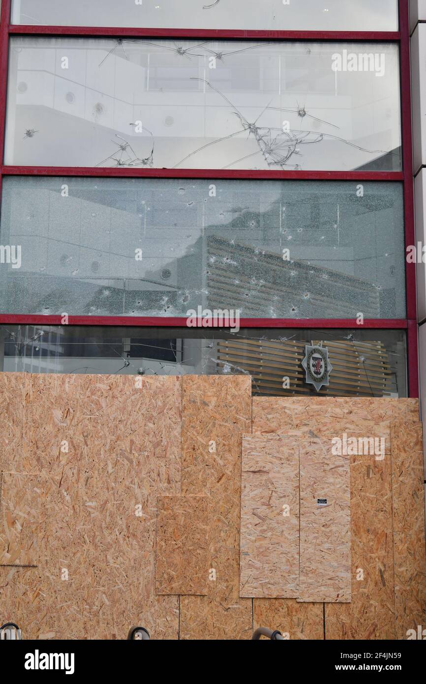 Windows which were damaged by thrown rocks are boarded up at Bridewell Police Station, Bristol, where protesters broke windows and vandalised the building on Sunday after demonstrating against the Government's controversial Police and Crime Bill. Picture date: Monday March 22, 2021. Stock Photo