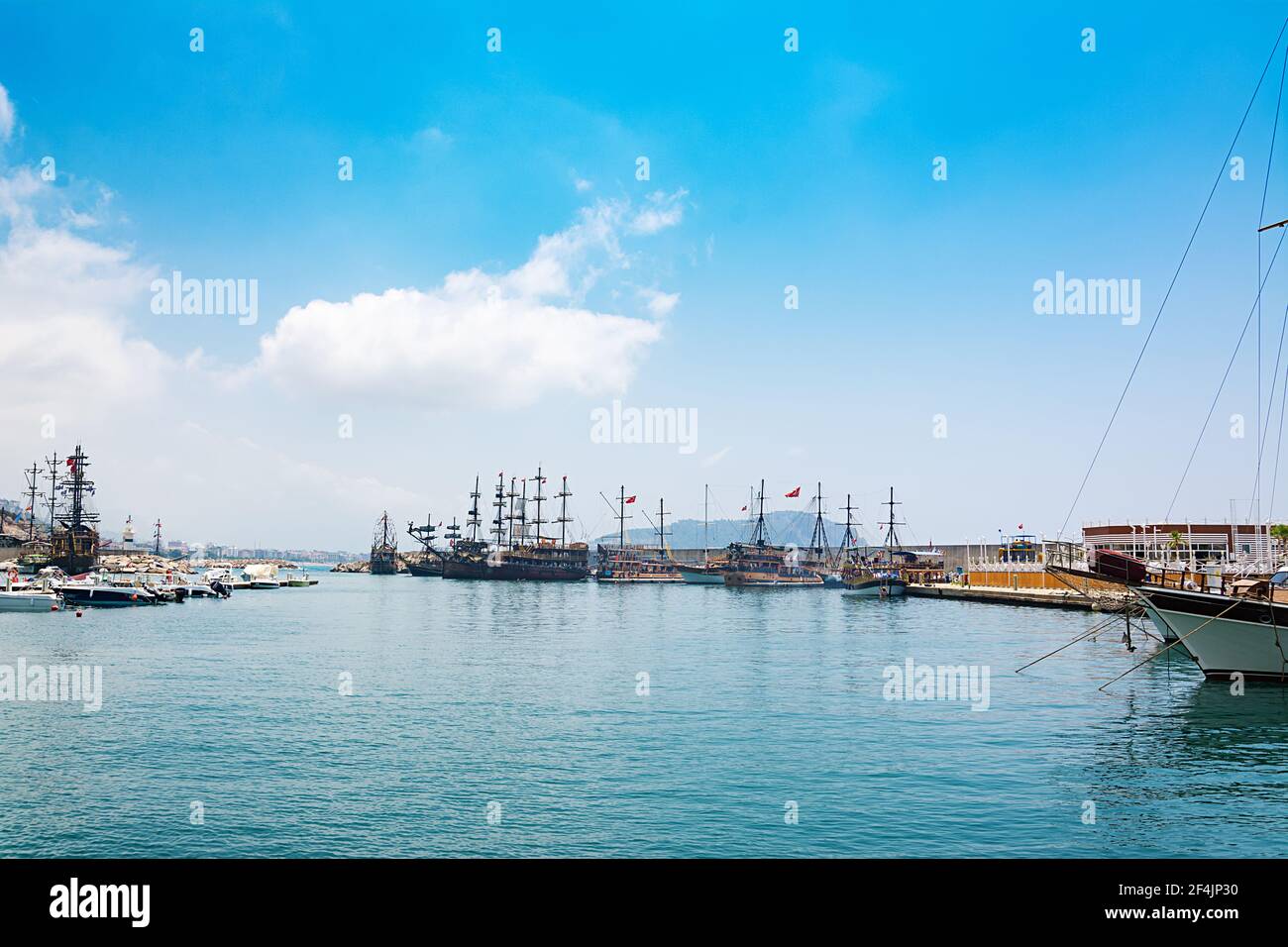 View of boats yachts and tourist galleons moored in old marina or port harbor at Mediterranean sea.  Turkey Stock Photo