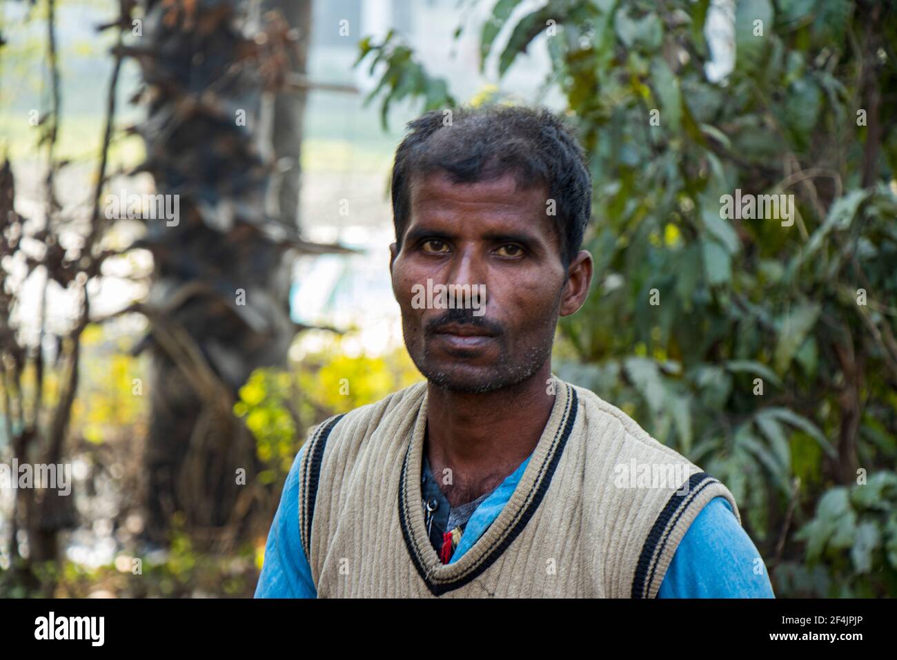 An Indian farmer portrait looking at camera - Begusarai, Bihar, India - 20-01-2021 Stock Photo