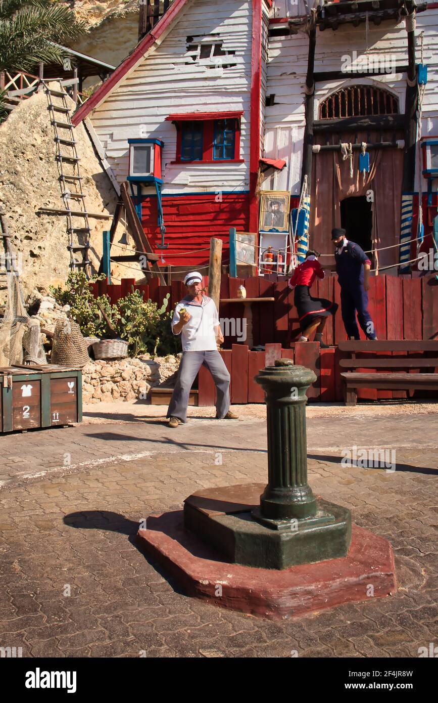 Popeye holding a can of spinach in a show at Popeye Village in Malta