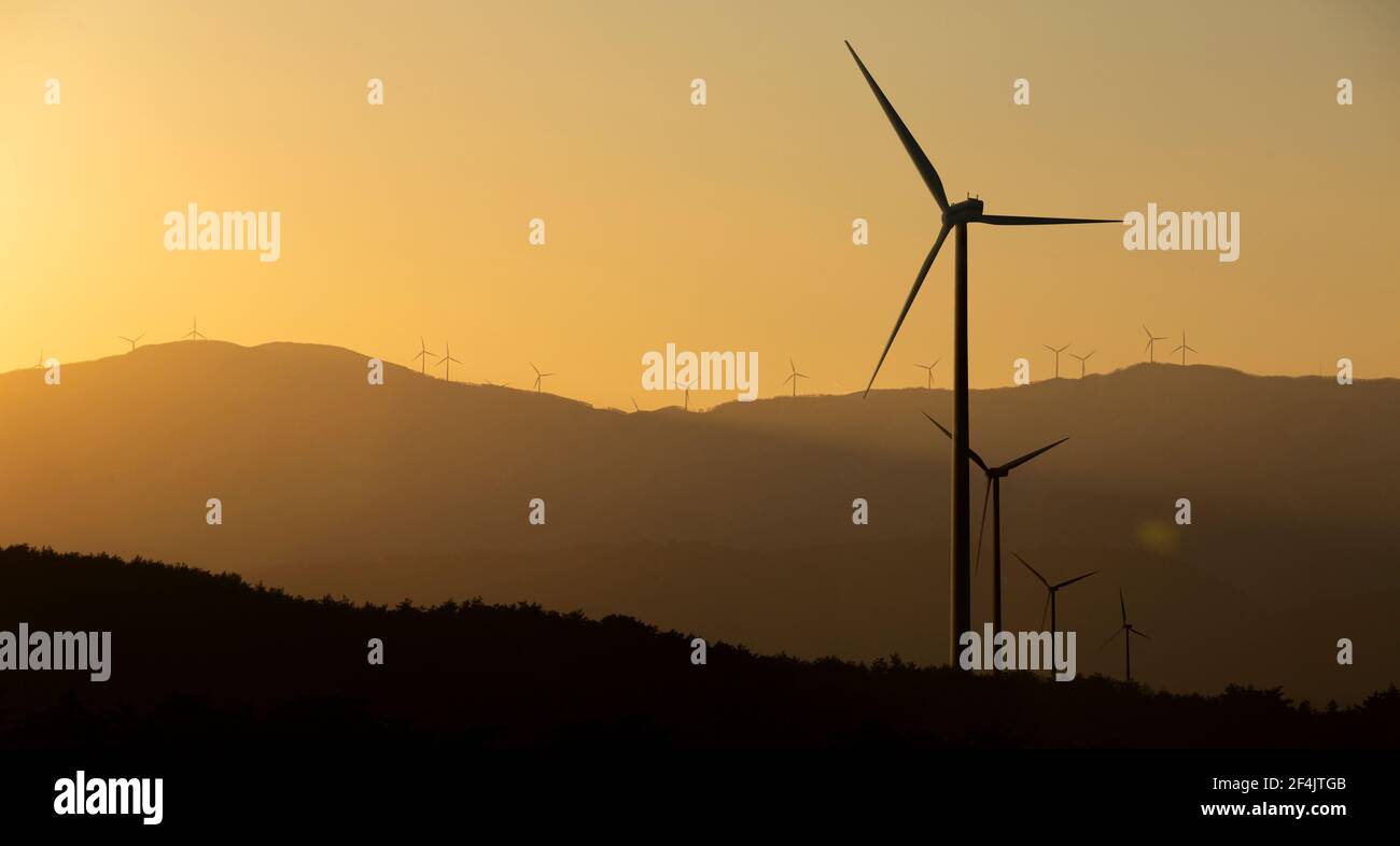 silhouettes of wind turbines at sunset Stock Photo - Alamy