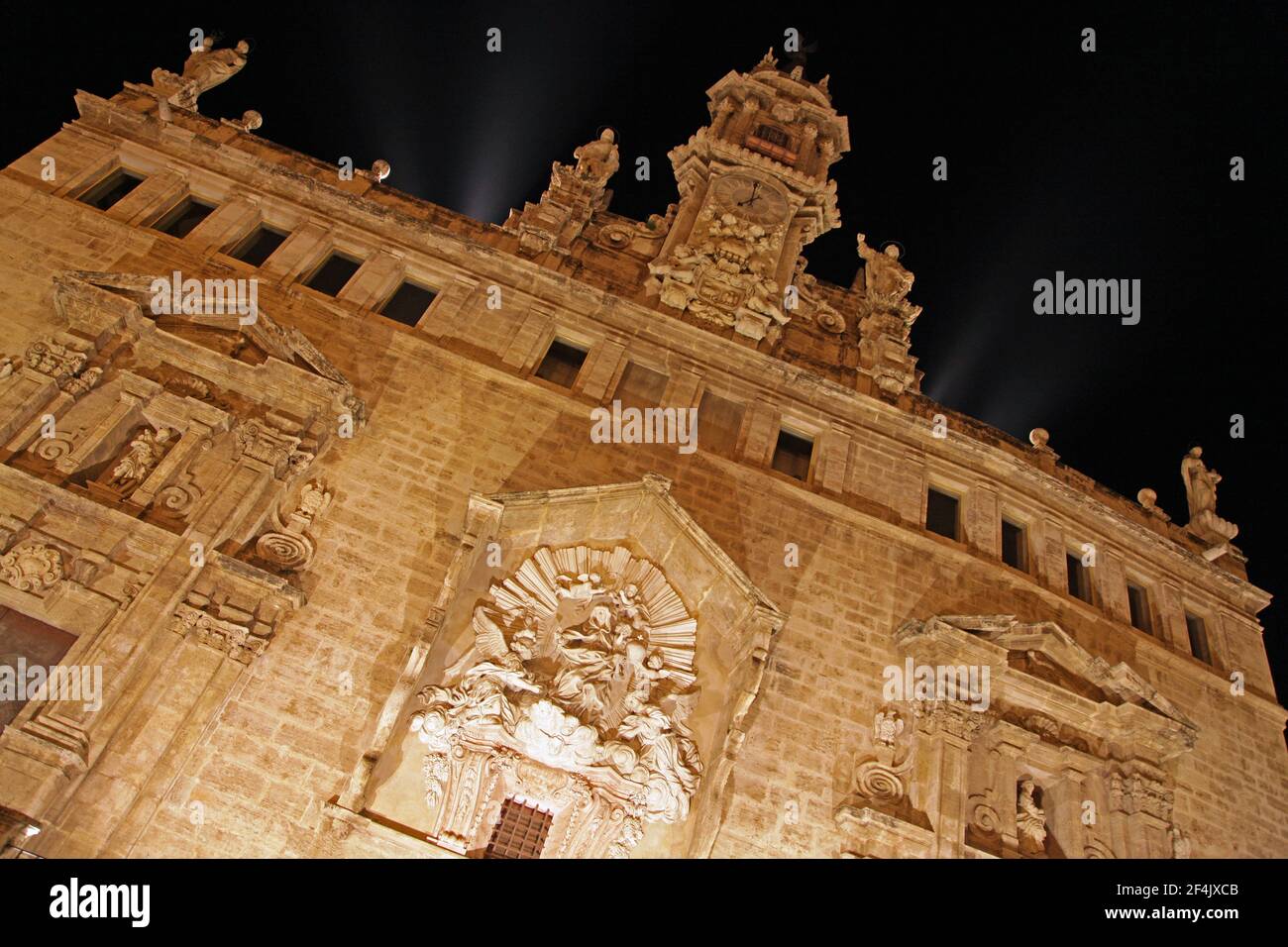 Church of the Santos Juanes,Iglesia de los Santos Juanes,Valencia Spain.Originally built in 1368,opposite La Lonja.Historic church built on the remnants of a former mosque. The original Gothic building burned down almost completely in 1592 and was later rebuilt in Baroque style.The main facade still features a walled up oculus of a rose window from the historic church.La Real Parroquia de los Santos Juanes,conocida como iglesia de San Juan del Mercado (Església de Sant Joan del Mercat, en valenciano),situada en Valencia, frente a la Lonja de la Seda, y al lado del Mercado Central. Stock Photo