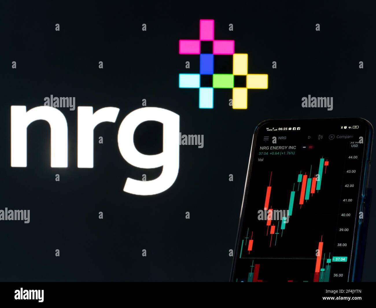 In this photo illustration the stock market information of NRG Energy Inc seen displayed on a smartphone with the NRG Energy Inc logo in the background. Stock Photo