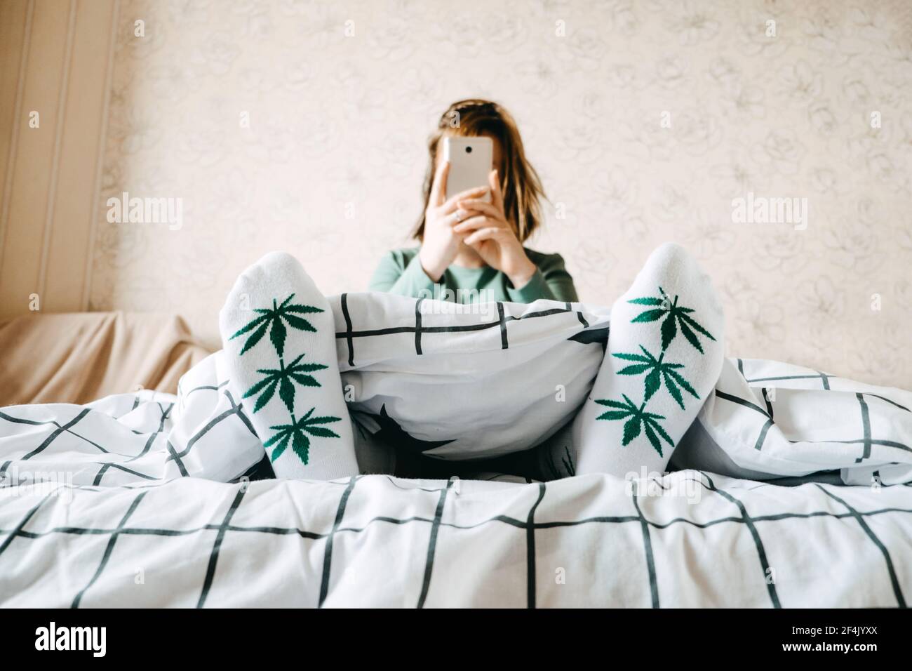 Self care, calm, mourning routine, start day. Mental health, self care, No stress, healthy habit, Use of Marijuana for Anxiety concept. Woman in socks Stock Photo