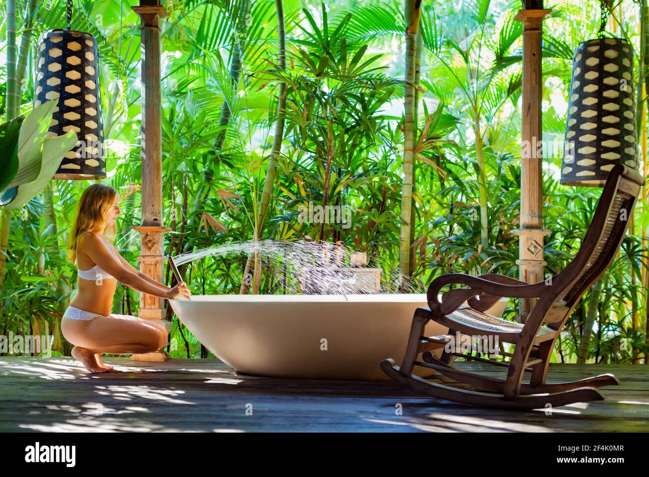 Woman enjoying outdoor shower hi-res stock photography and images - Alamy
