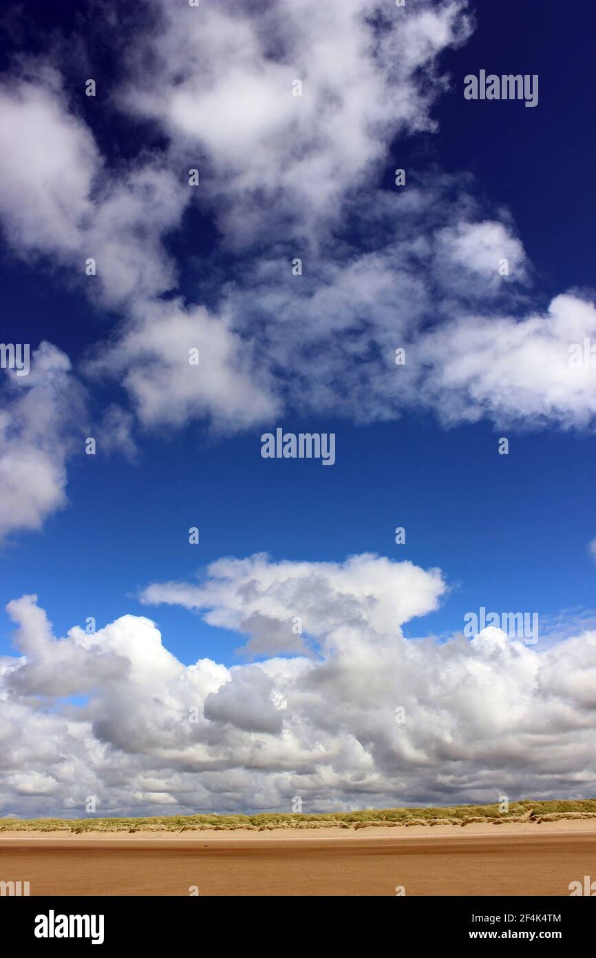 Billowing Cumulus Clouds Above The Sand Dunes Of Formby Beach, Sefton Coast UK Stock Photo