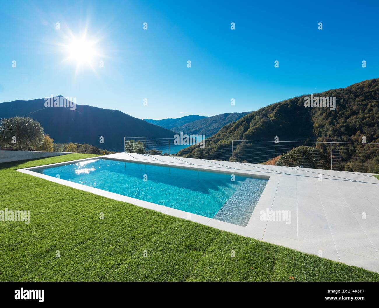 Swimming pool with lake and valley view Stock Photo