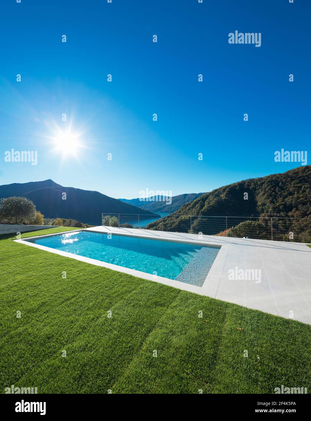 Swimming pool with lake and valley view Stock Photo