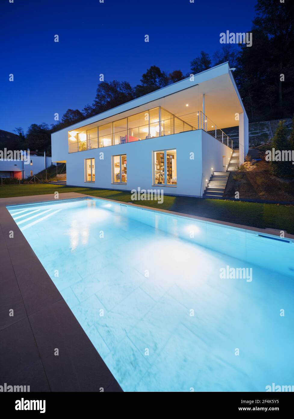 Modern house, exterior in the night, lights on Stock Photo