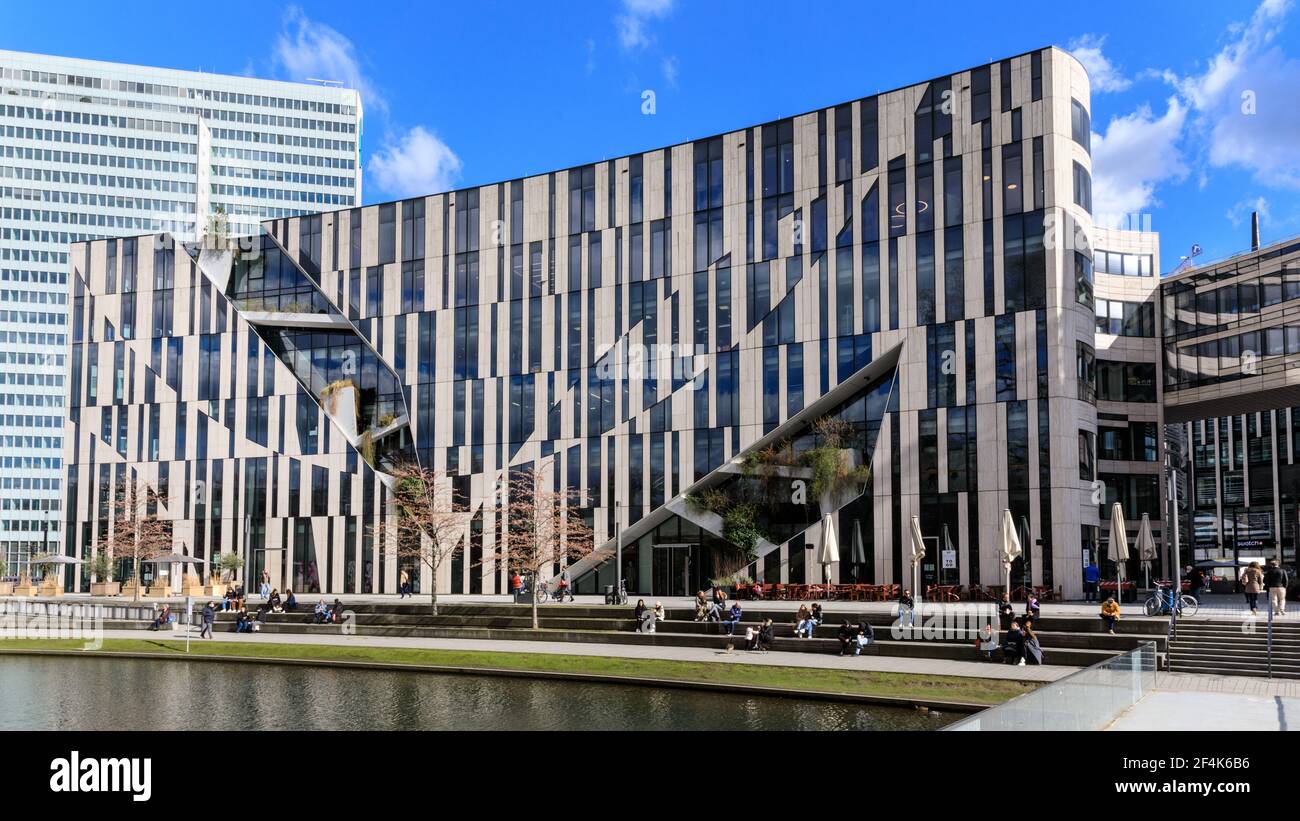 Kö-Bogen shopping centre and mall exterior, people sitting in the sunshine, Dusseldorf, NRW, Germany Stock Photo