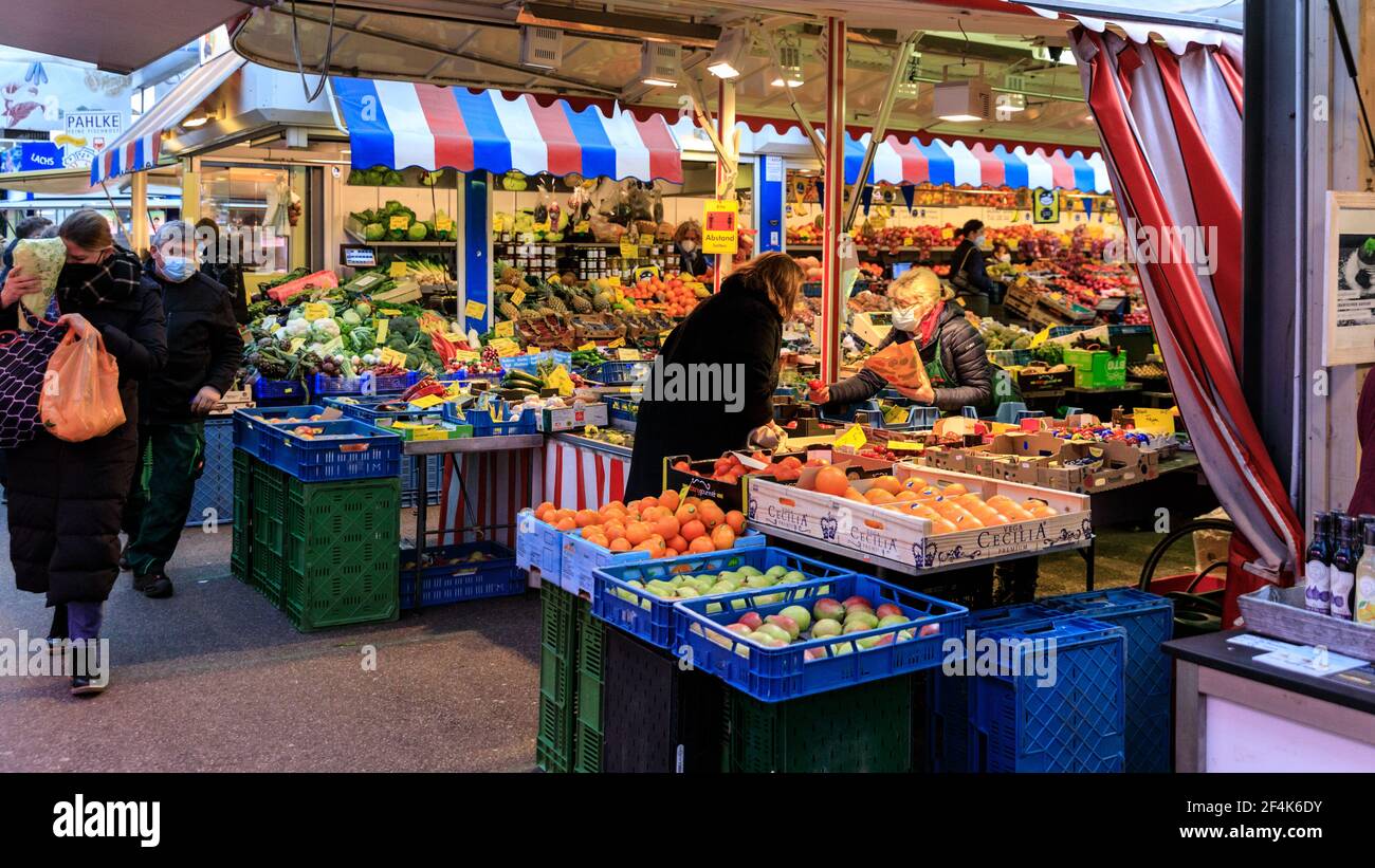 Carlsplatz Markt indoor food market, people shopping at fruit and