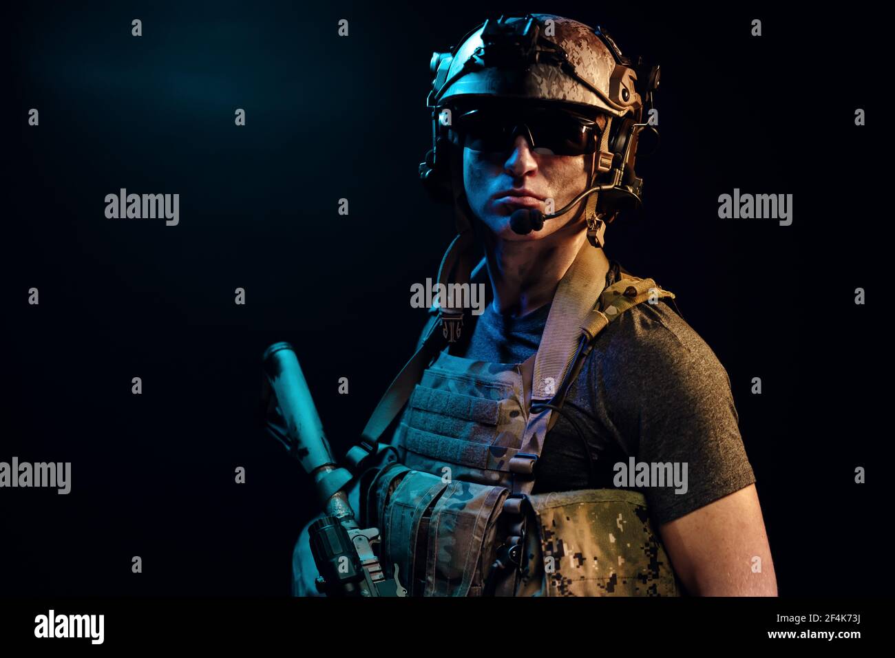Special forces soldier with rifle on black background Stock Photo - Alamy