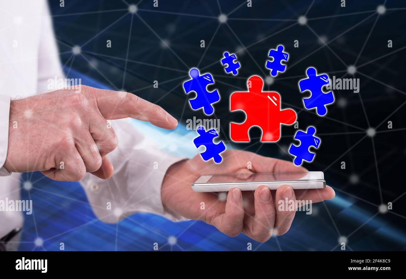 Teamwork concept above a smartphone held by a man Stock Photo - Alamy