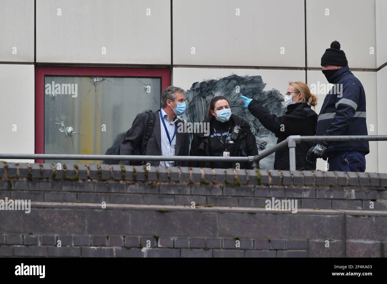 Police forensic officers on the roof of Bridewell Police Station in Bristol, where protesters broke windows and vandalised the building on Sunday following a demonstration against the Government's controversial Police and Crime Bill. Picture date: Monday March 22, 2021. Stock Photo