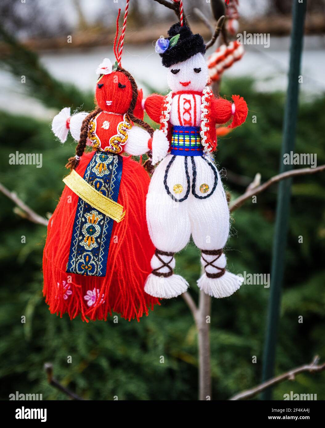 Martenitsa read and white wool dolls,  Bulgarian tradition for Baba Marta, March folklore. Stock Photo