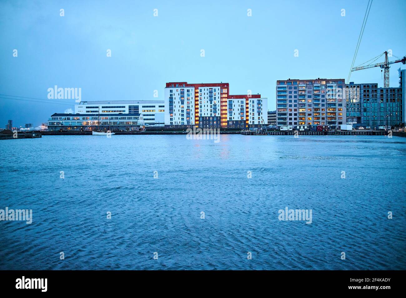 dark blue and grey water by city with modern apartments Stock Photo - Alamy