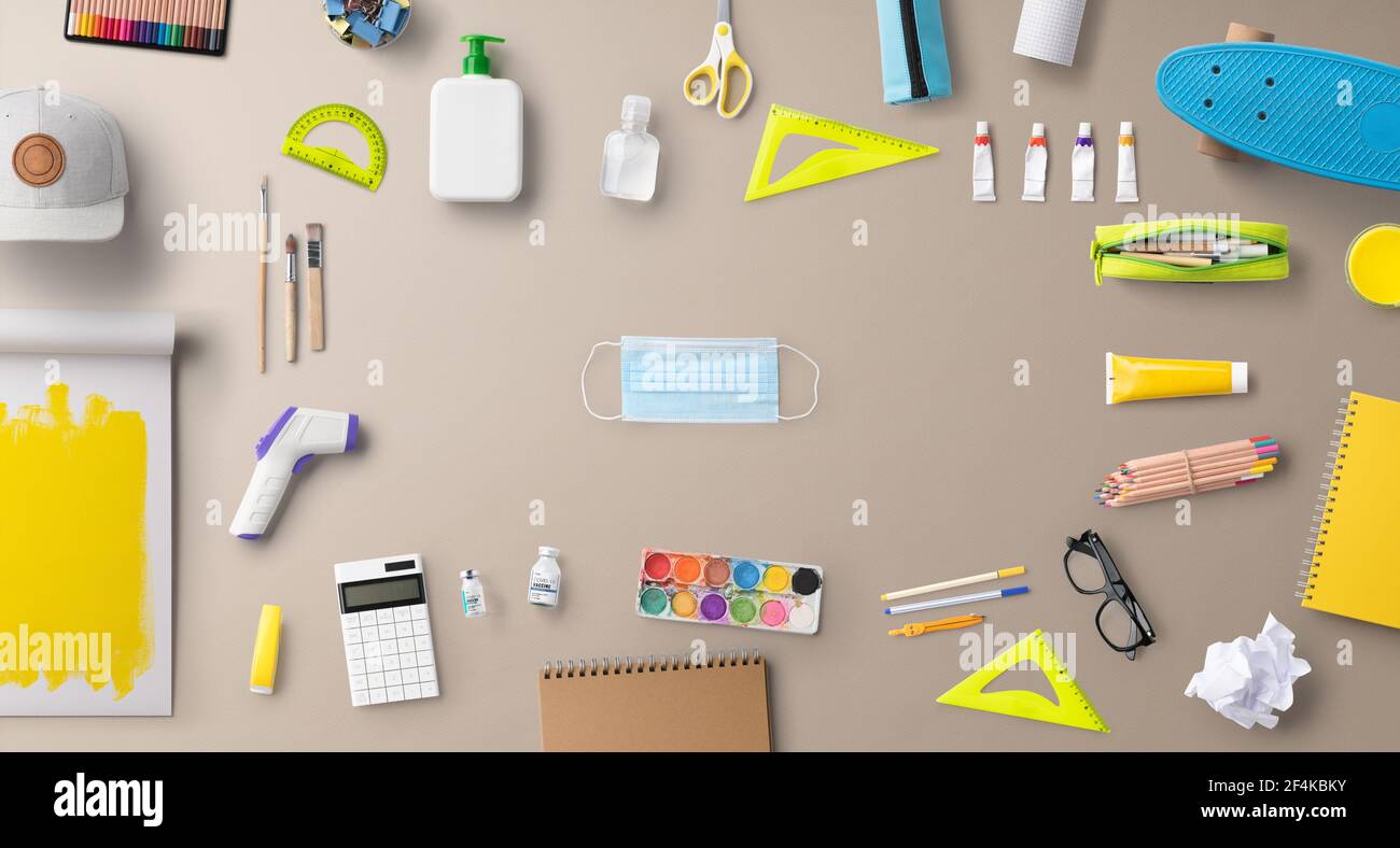 Flat lay top view of face mask and school supplies, back to school and ...