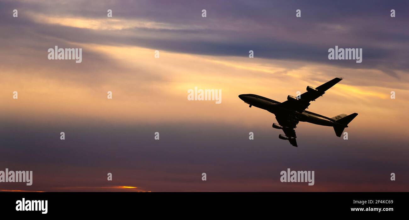 Airplane take off on a sunset. Stock Photo