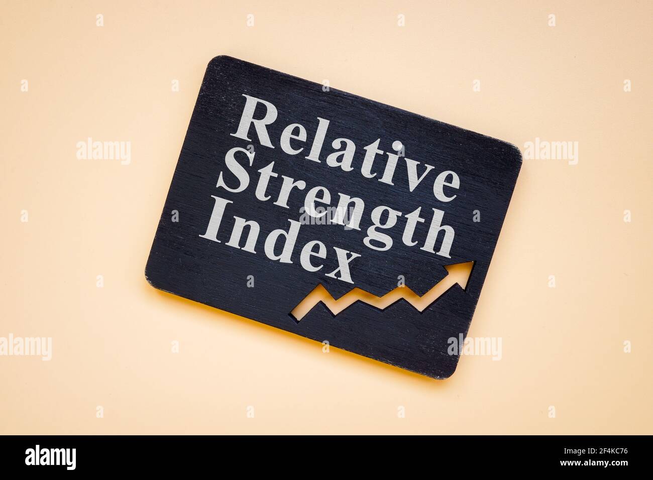 RSI Relative Strength Index words on the black plate. Stock Photo