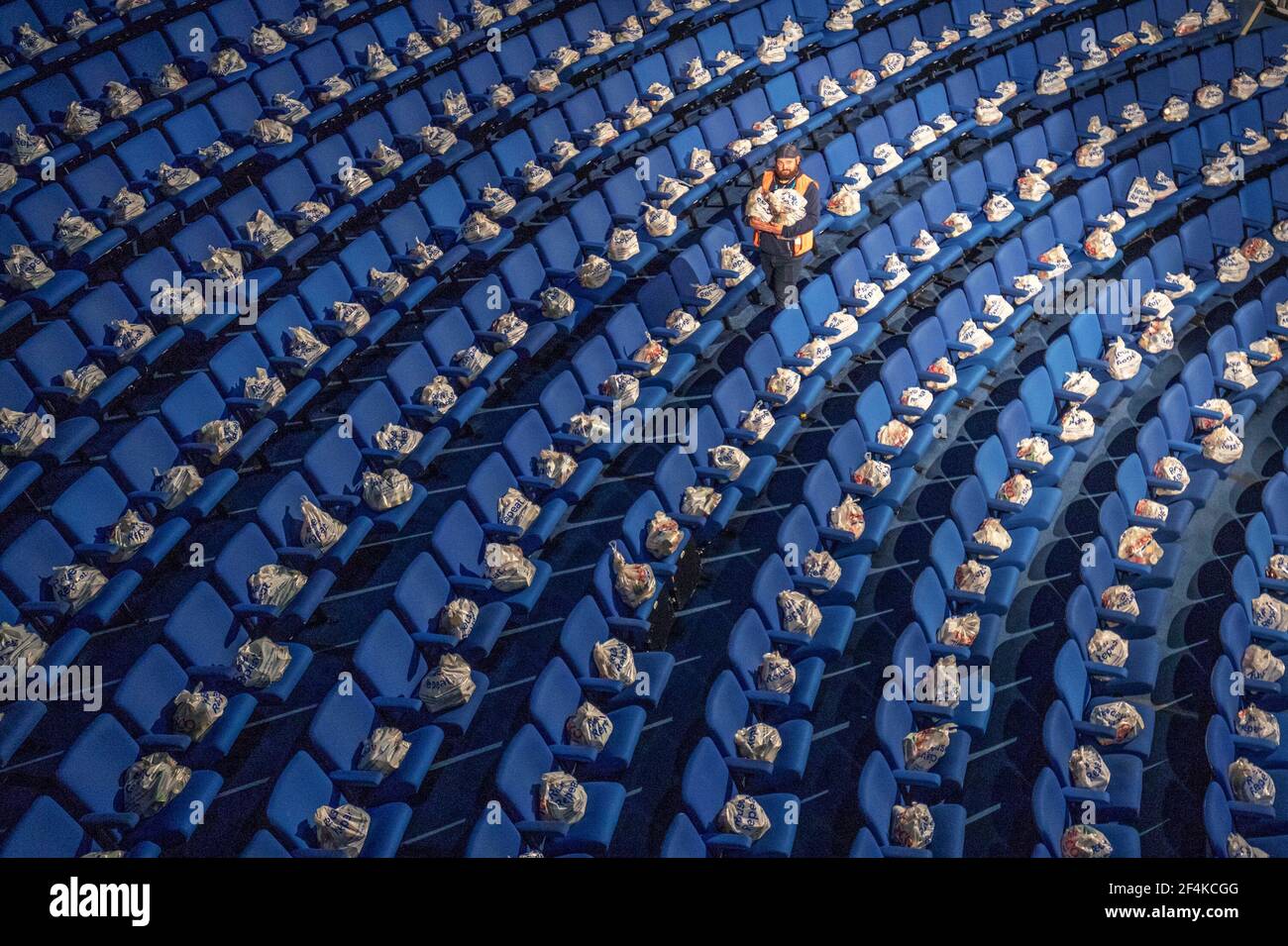 File photo dated 12/07/20 of Ben Senior, from The Highland Council, walking amongst some of the thousands of food packages filled with supplies for Highlanders still shielding from the coronavirus pandemic in the auditorium of the Empire Theatre at Eden Court in Inverness. Tuesday marks the first anniversary of the announcement on March 23, 2020 of the first UK-wide lockdown. Issue date: Monday March 22, 2021. Stock Photo