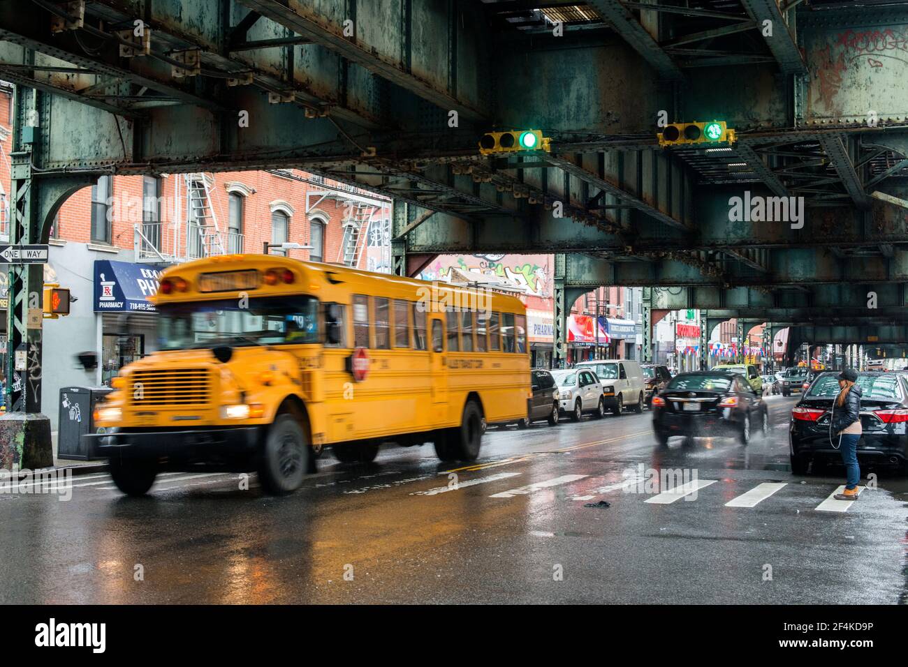 New York City, USA. Yellow schoolbus driving through the rain