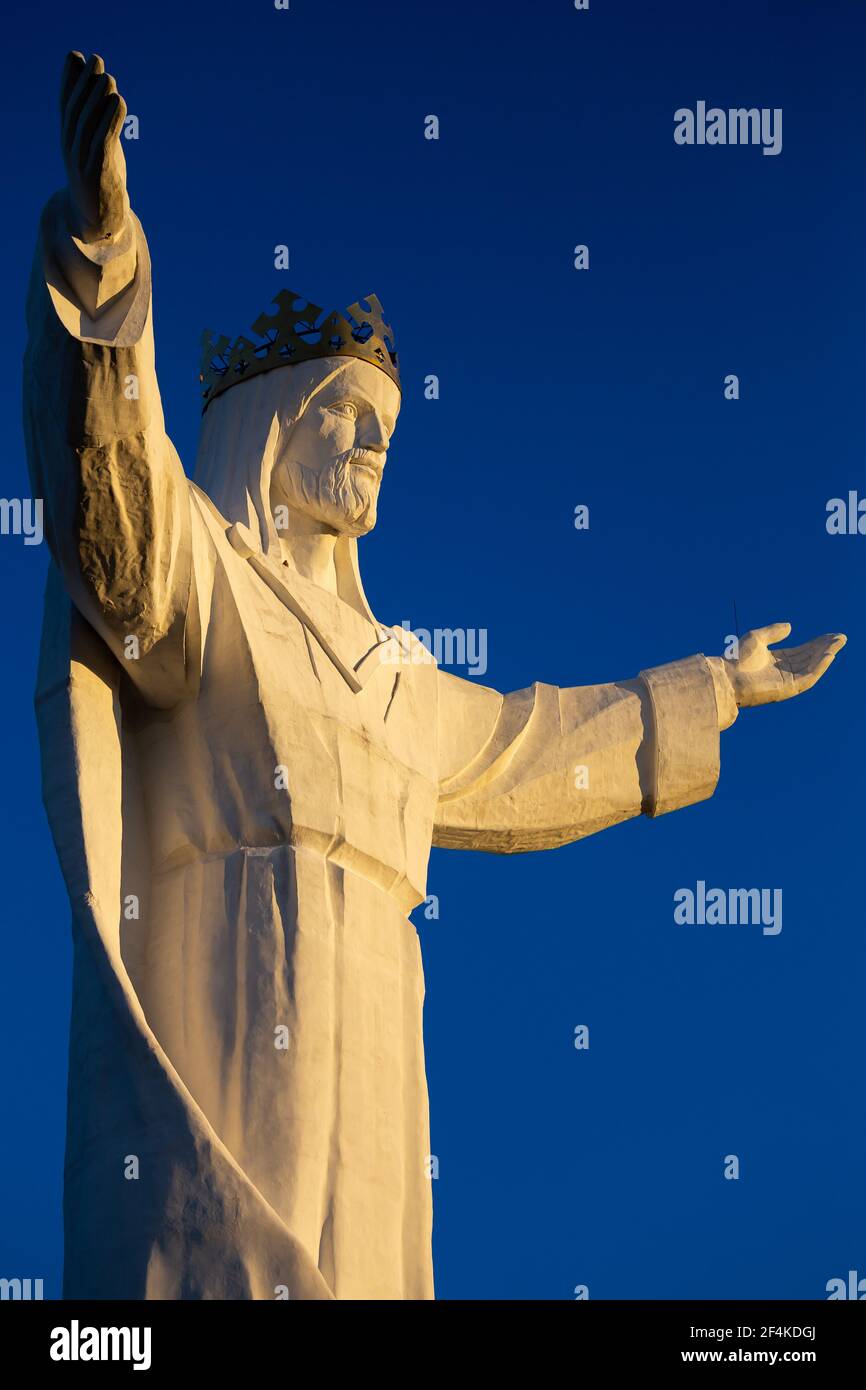 The world's tallest statue of Jesus Christ, Swiebodzin, Poland. Deep blue skies in the background. Made in the late afternoon on a sunny day. Stock Photo