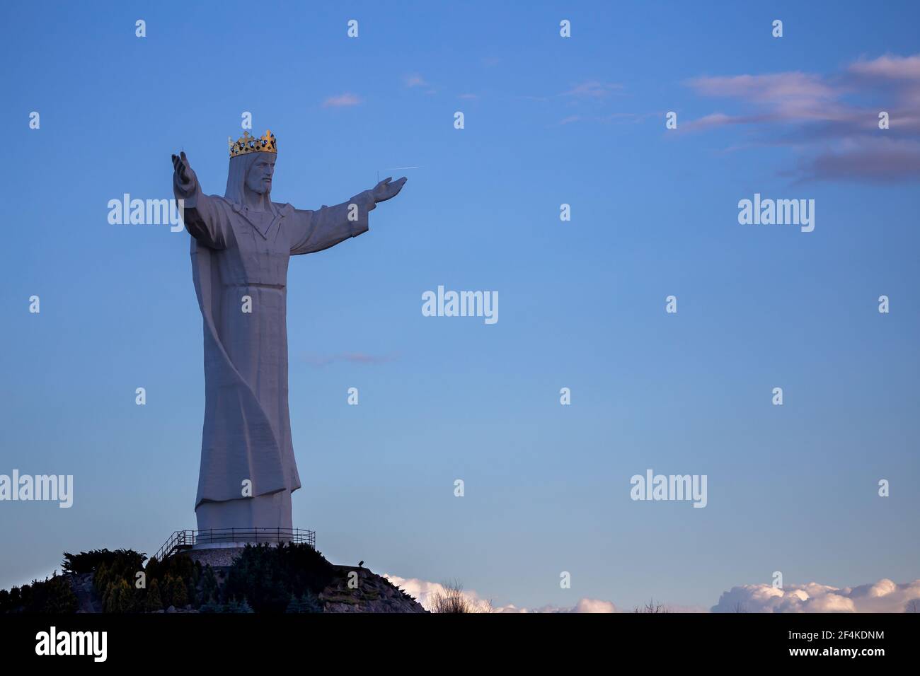 The world's tallest statue of Jesus Christ, Swiebodzin, Poland. Deep blue skies in the background. Made in the late afternoon on a sunny day. Stock Photo