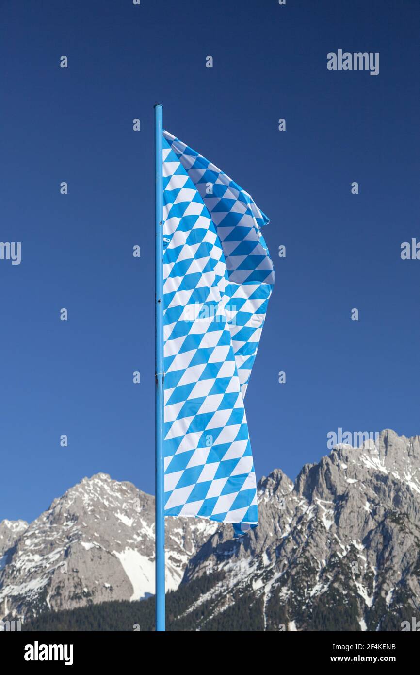 geography / travel, Germany, Bavaria, Mittenwald, Bavarian ensign in front of the Karwendel (mountain), Additional-Rights-Clearance-Info-Not-Available Stock Photo
