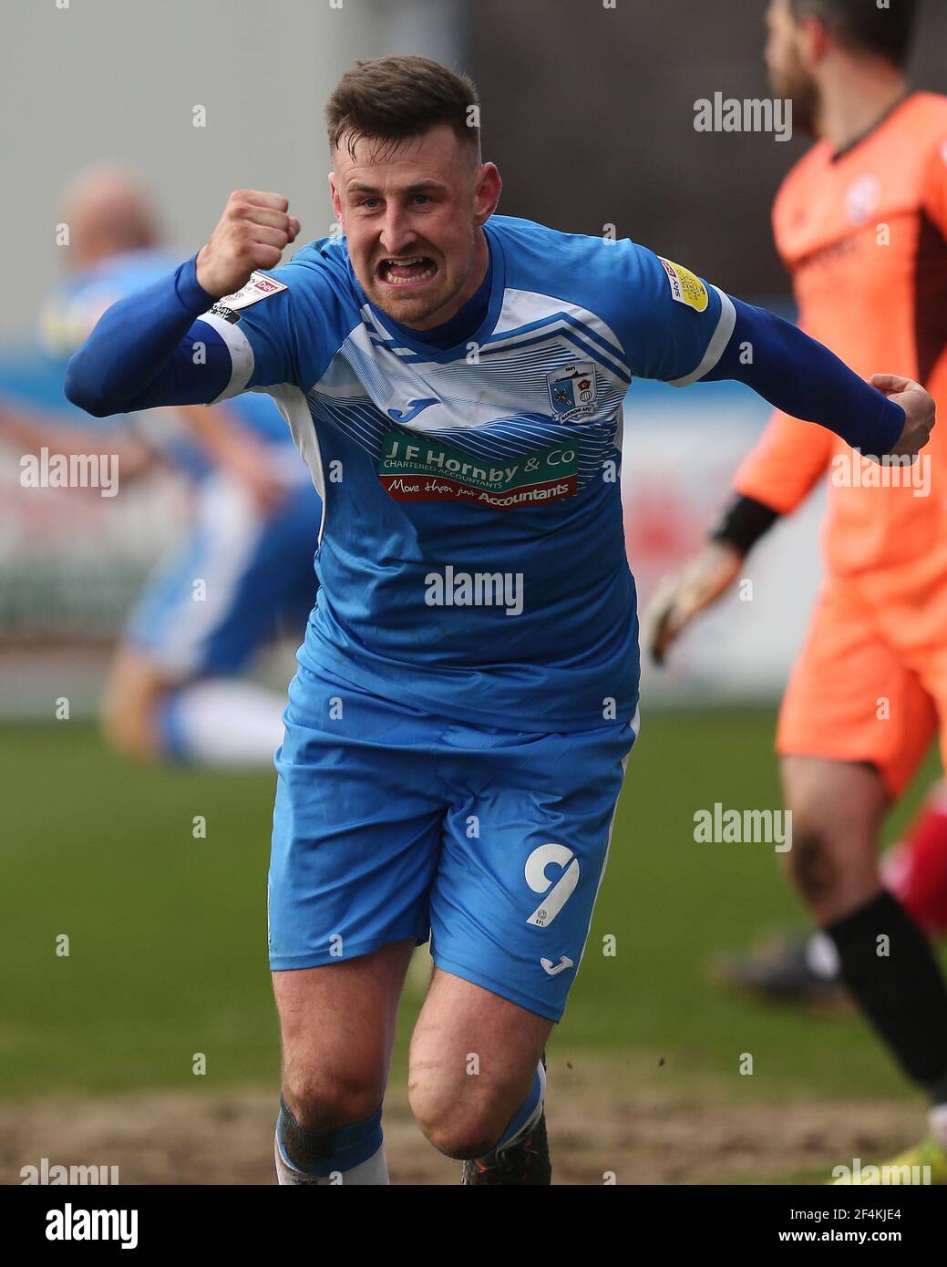 BARROW IN FURNESS, UK. MARCH 20TH: Scott Quigley of Barrow celebrates after  scoring their third and winning goal during the Sky Bet League 2 match  between Barrow and Crawley Town at the