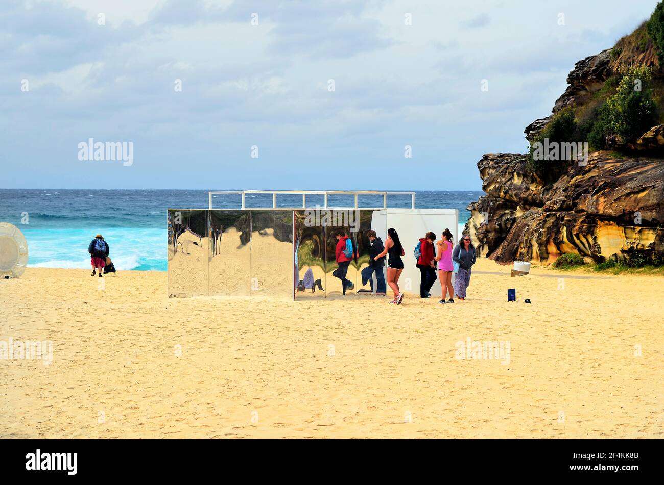 Sydney, NSW, Australia - October 31,2017: Unidentified people on beach of Tamarama by outdoor exhibition Sculpture by the Sea, artwork Temple from Iso Stock Photo
