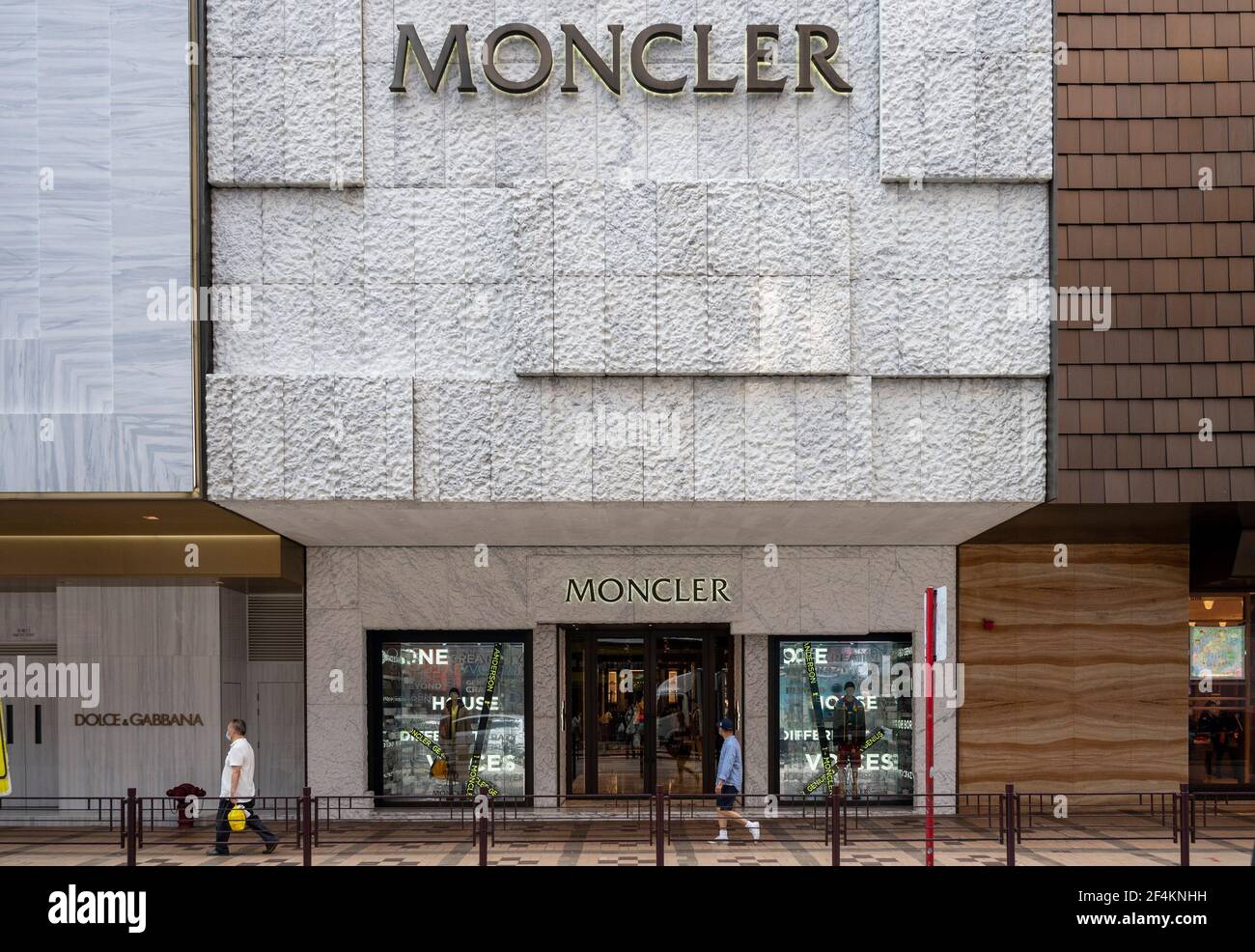 Pedestrians walk past the Italian luxury fashion brand Moncler store seen  in Hong Kong. (Photo by Budrul Chukrut / SOPA Images/Sipa USA Stock Photo -  Alamy