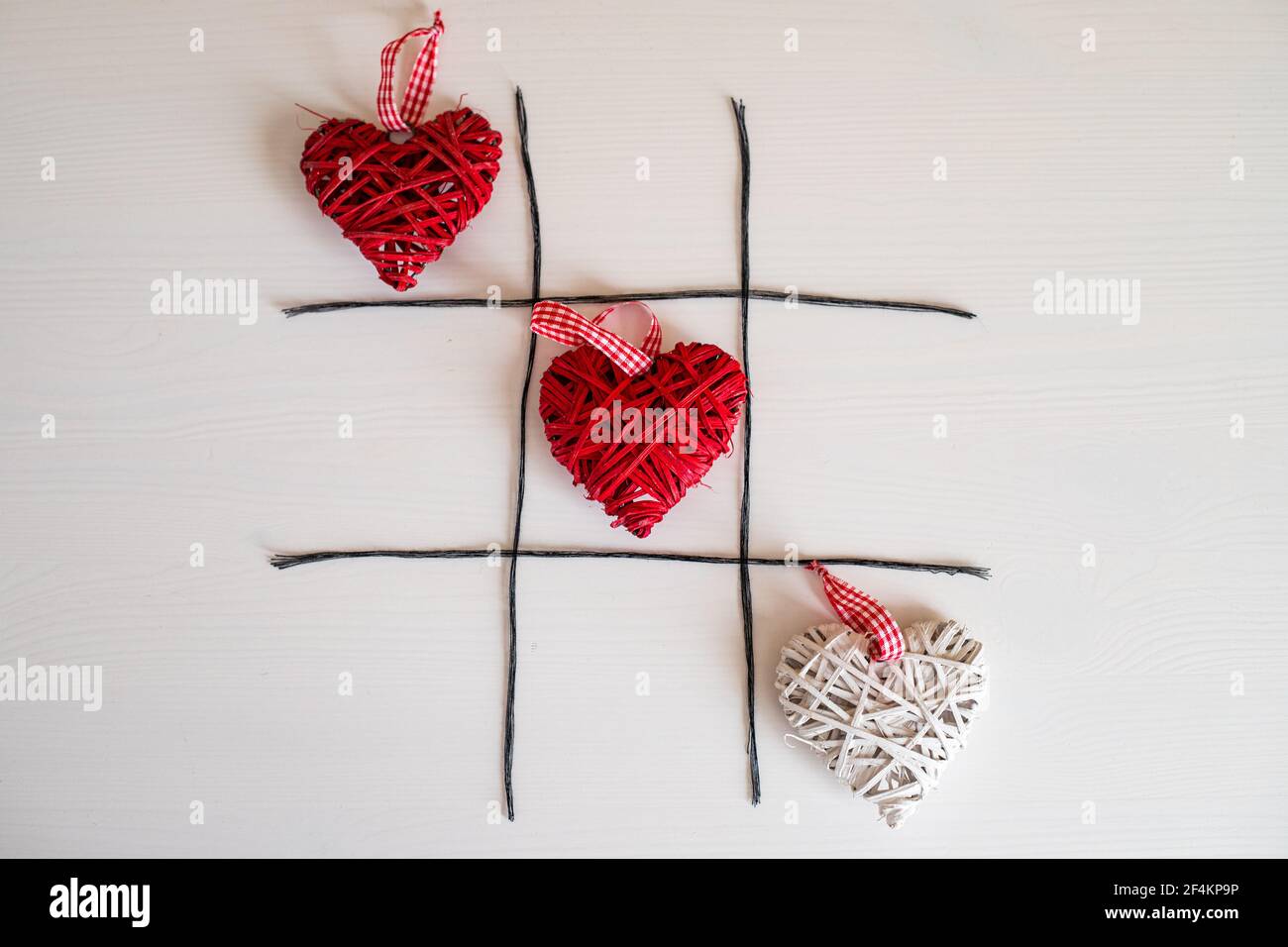 Noughts and crosses game with hearts for Valentines day Stock Photo