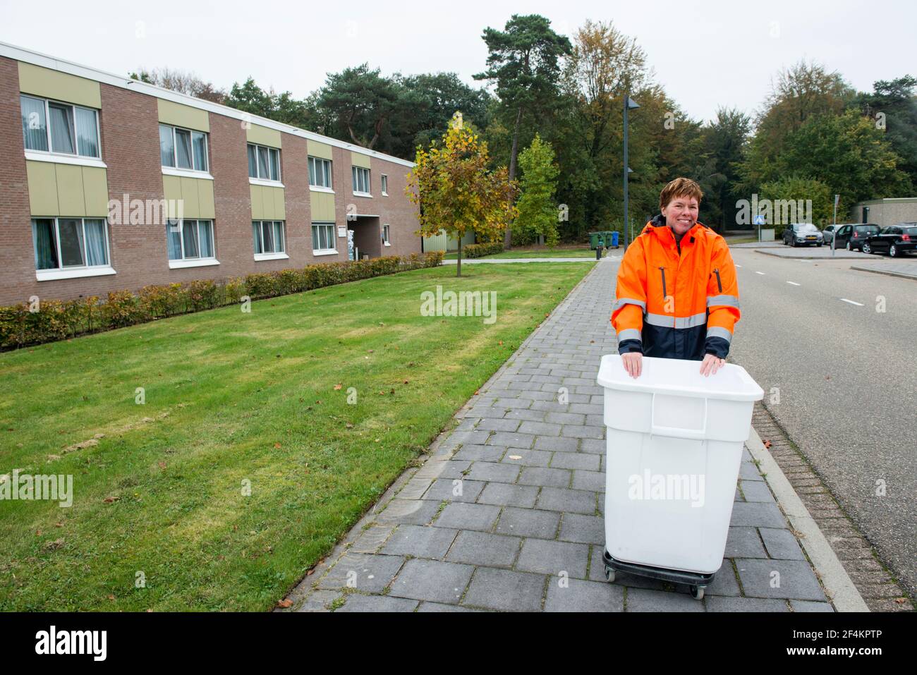 Airbase, Gilze-Rijen, Netherlands. Single mentally challenged civilian employee of an Airbase taking care of laundry at the Dutch airforce base. Stock Photo