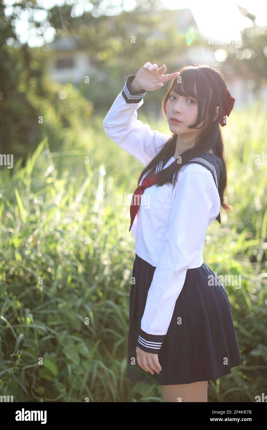 Asian school girl with countryside background Stock Photo