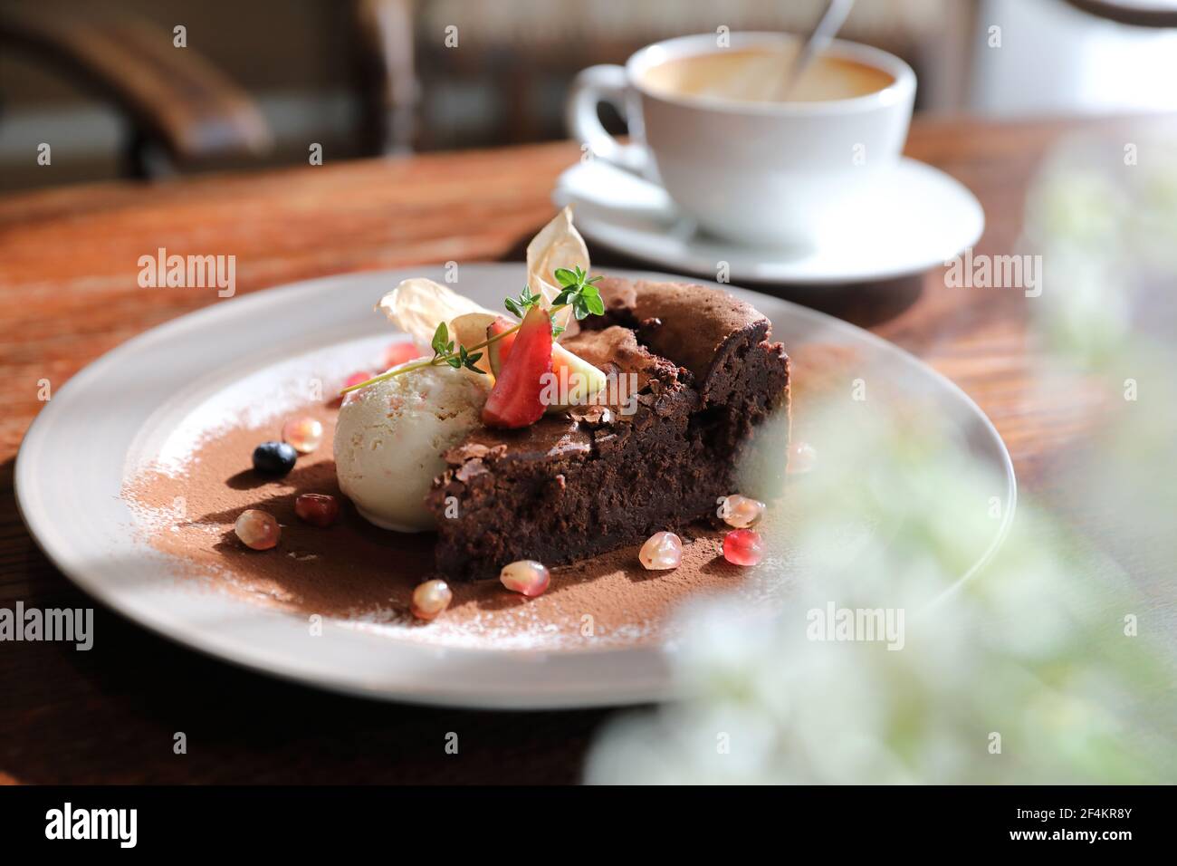 Chocolate cake with ice cream and coffee dessert on wood table Stock