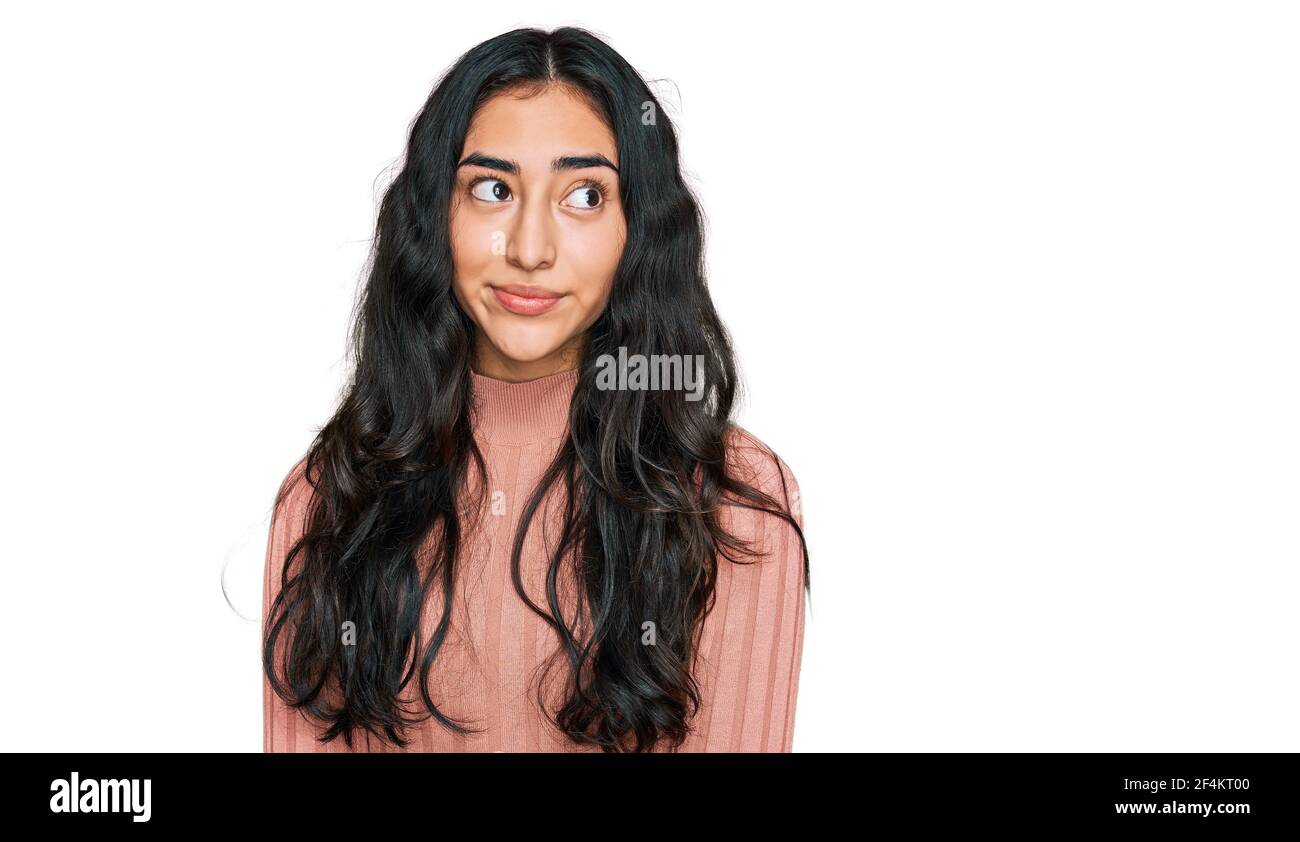 Hispanic teen girl thinking hi-res stock photography and images - Alamy