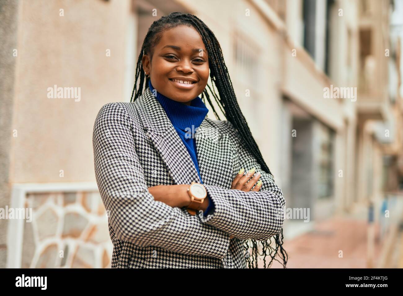 Young african american businesswoman with arms crossed smiling happy at ...