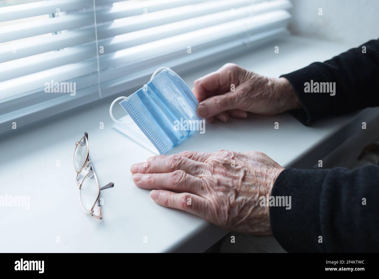 Old people during quarantine spending time mostly at home. Stock Photo